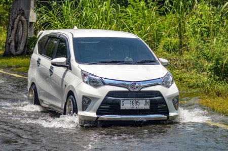 a white car that crashed into floods in Gresik Regency, Indonesia, 21 February 2024.