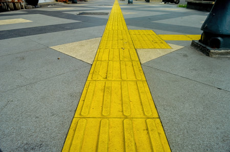 tactile paving for blind handicap on tiles pathway, walkway for blindness people.の写真素材