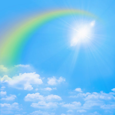 Sun and rainbow in blue skyの写真素材