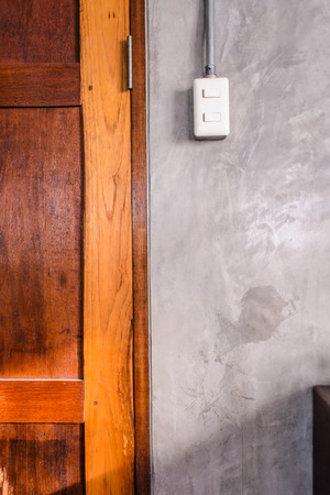 white plastic switch panel is on loft style wallの写真素材