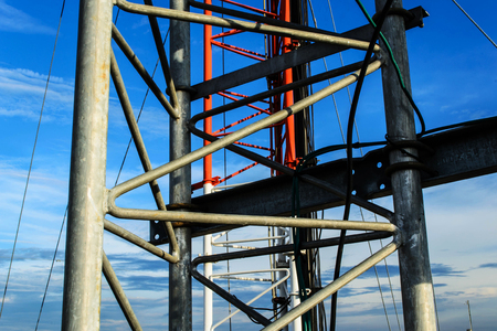 High mast metal structure telecommunication on tower with blue sky.の写真素材