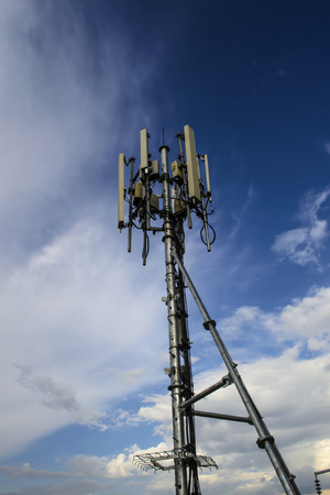 High mast metal structure telecommunication on tower with blue sky.の写真素材