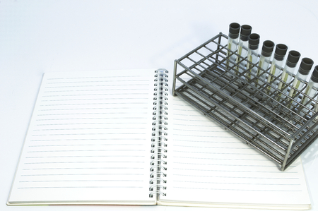 Gray laboratory tube with stainless rack on the white background.の写真素材