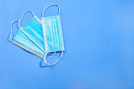 Protection mask against virus isolated on a blue backgroundの写真素材