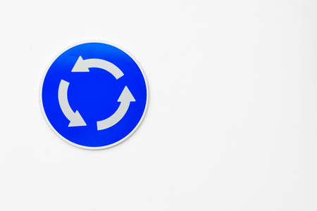 Traffic sign - Rotating circulation, on white background.の写真素材