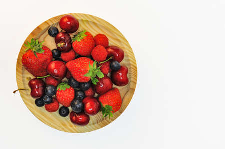 Bowl of healthy fresh fruit on white background, top viewの写真素材