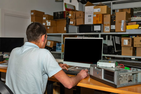 Computer technician working in workshop