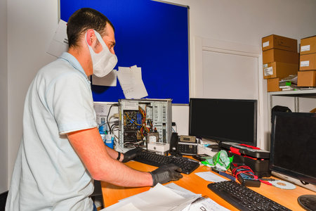 Computer technician working in workshop