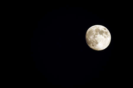 Full moon in a clear sky - Night photography.の写真素材