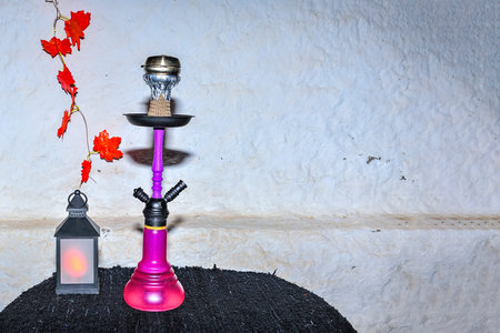 Water pipe or hookah, prepared on the table of a Pub.
