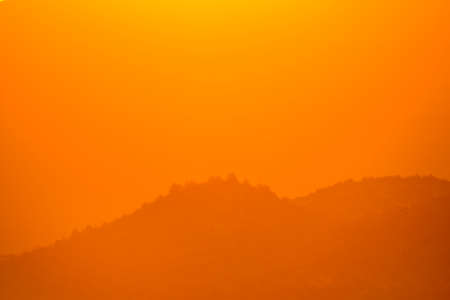 Orange sunset over the mountains of Granada.の写真素材