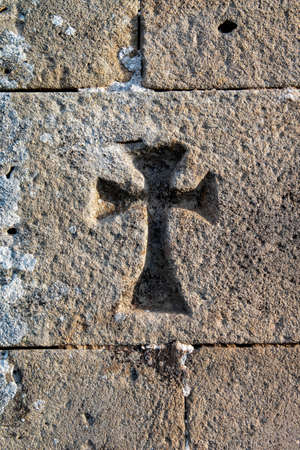 Crosses carved in the stone of the facade of the church of San Miguel in La Riva.の写真素材