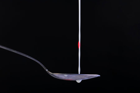 Splash of fresh milk on a spoon