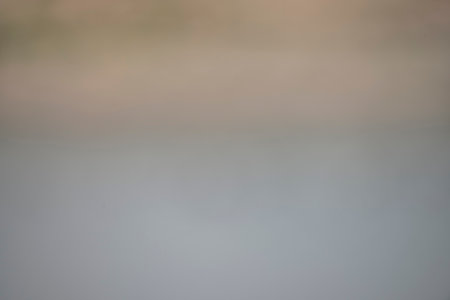 Soft focus gradient from white to grey, reminiscent of a gentle mist.の写真素材