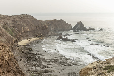 Scenic view of the rugged cliffs and the Atlantic Ocean at Cabo San Vicente, Portugal. The unique...