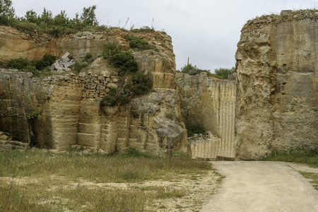 A breathtaking view of the intricate stone carvings and structures at Lithica Pedreres de s'Hostal in Menorca, Spain, showcasing the quarry's historical and artistic significance.の写真素材