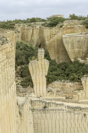 A breathtaking view of the intricate stone carvings and structures at Lithica Pedreres de s'Hostal in Menorca, Spain, showcasing the quarry's historical and artistic significance.の写真素材