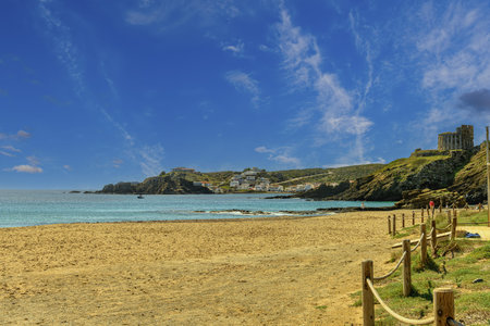 Stunning coastal landscape of Cala Sa Mesquida in Menorca, featuring clear blue waters, rocky...