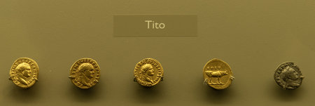 Display of ancient Roman gold coins featuring Emperor Titus at the Merida Museum, Spain,...