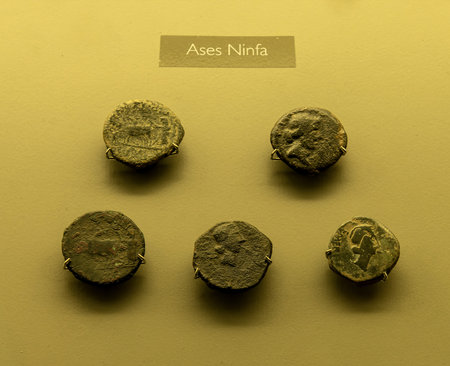 A display of ancient Roman Aces Ninfa coins featuring intricate designs and inscriptions. A captivating exhibit for history and numismatic enthusiasts.の写真素材