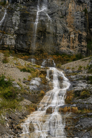 Picturesque high mountain waterfall in the sopeliana ravine in Bujaruelo, in the Ordesa National Park.の写真素材