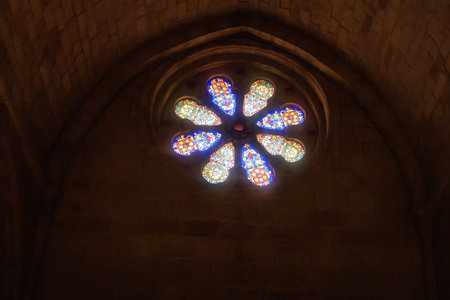 Magnificent Romanesque facade of a historic church, showcasing intricate carvings, a rose window,...
