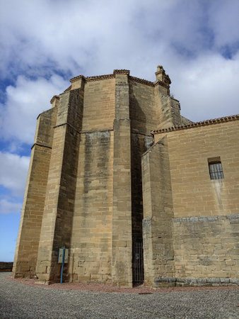Church of Santa Maria la Mayor in San Vicente de la Sonsierra, Spain, featuring Gothic architecture, massive stone buttresses, and a medieval design.の写真素材