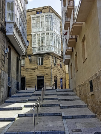 Narrow historic street in Haro, Spain, featuring timber-framed houses, stone arches, and balconies.の写真素材