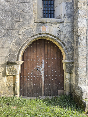 Small Romanesque stone church with bell gable in quiet rural settingの写真素材