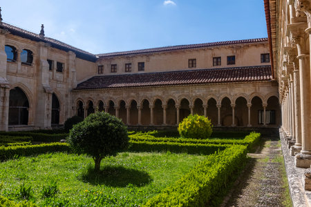 Cistercian cloister with symmetrical garden and stone arcades at Santa Maria and San Andres Abbey in...