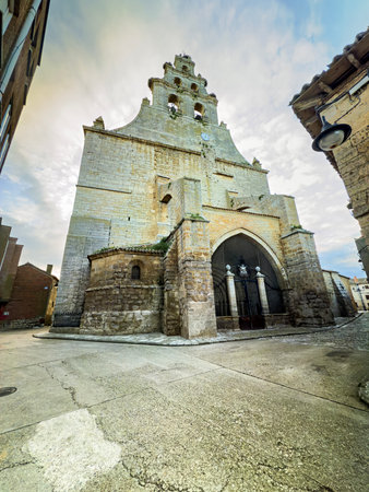 Stone bell gable with multiple arches and clock at the Church of San Pedro in Amusco Palenciaの写真素材