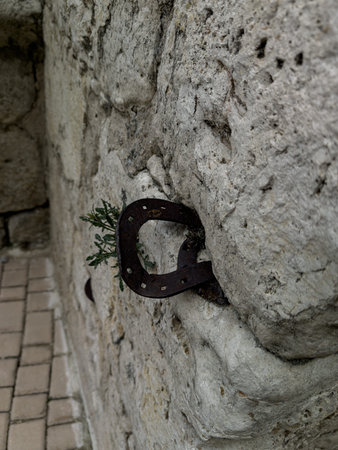 Old iron horseshoe embedded in the wall of the Church
