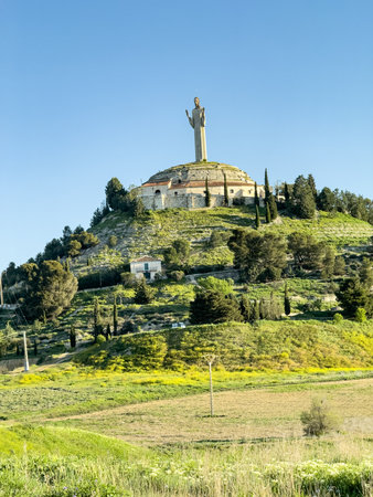 Massive Christ of Otero statue in Palencia with arms raised and modern sculptural styleの写真素材