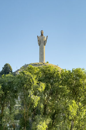 Massive Christ of Otero statue in Palencia with arms raised and modern sculptural style