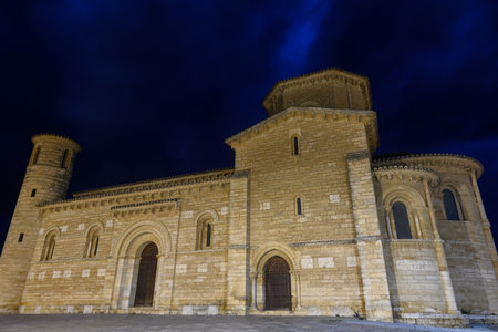 Illuminated facade of San Martin de Tours Church in Fromista at nightの写真素材