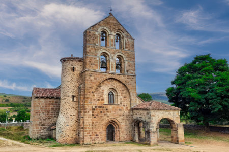 Historic Romanesque church with arched entrance and bell tower in Cantamuda, Spainの写真素材
