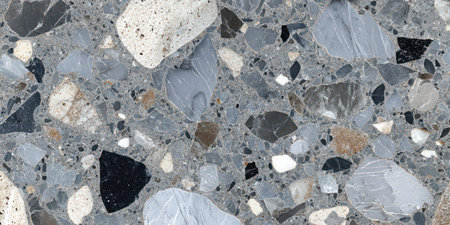 Detailed texture of a terrazzo surface featuring marble, quartz, and golden stone pieces.