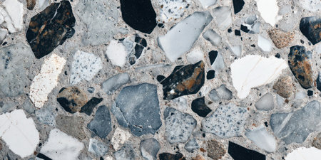 Detailed texture of a terrazzo surface featuring marble, quartz, and golden stone pieces.の写真素材