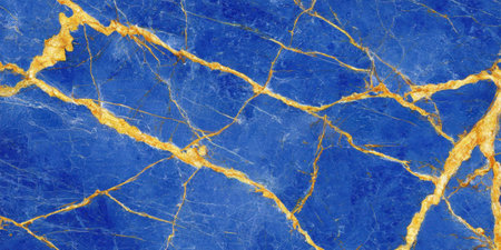 Polished blue marble surface with contrasting golden veins and intricate crack patterns.の写真素材