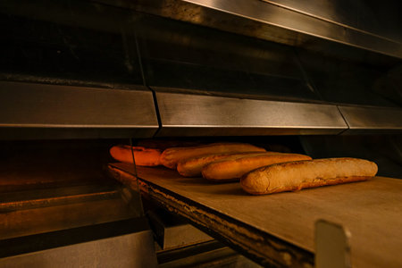 Freshly baked bread in the traditional oven door