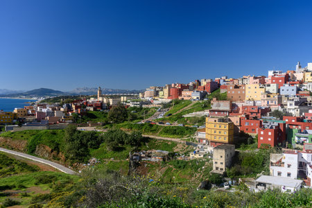 Panoramic view of El Principe in Ceuta with colorful houses and coastal backdrop.の写真素材