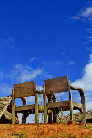 Two wood chair in countryside and blue skyの写真素材