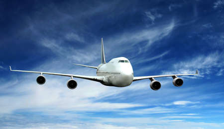 a airplane fly on blue sky の写真素材