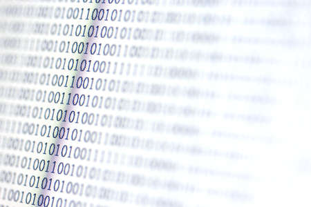 0,1, binary code on LED computer monitor の写真素材