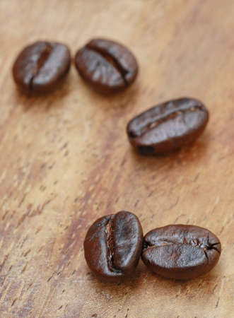 coffee seed on wooden table の写真素材