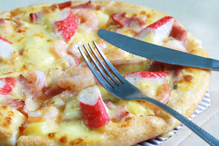 pizza with fork and knifeの写真素材