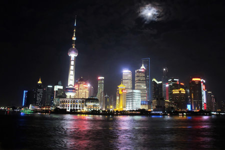 Shanghai tower with full moon night, China 