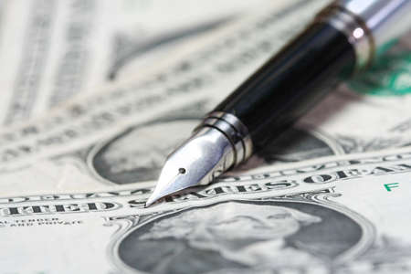 Metal Nib Pen on dollar billの写真素材
