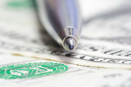 ballpoint metal pen on US dollar billの写真素材
