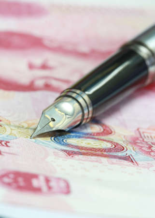Metal Nib Pen on china money billの写真素材